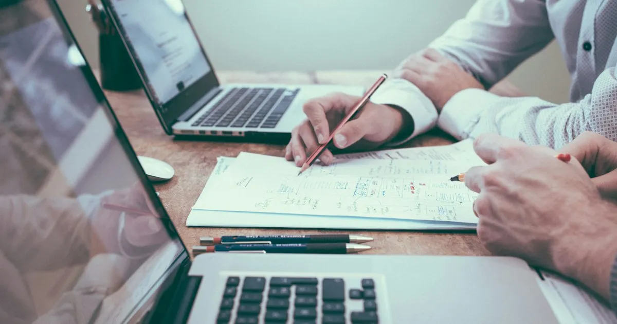 A China sourcing agent reviewing technical product specifications, project scopes, and supplier audit files